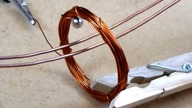 Spherical magnet on copper rail and Electromagnetic Induction