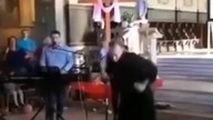 A priest high on drugs dances like crazy...