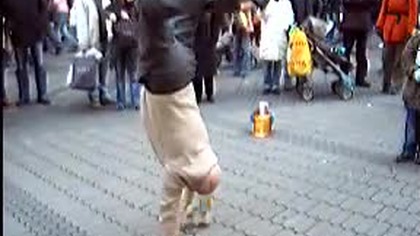 Old man doing turtle freeze on a bottle