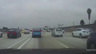 LiveLeak - Man with headphones strolling in lanes of 110 Fwy during morning rush hour