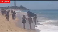 LiveLeak - Migrants land on packed beach in southern Spain