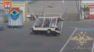 LiveLeak - Driver of a golf cart drives off the sidewalk and onto the beach