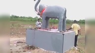 LiveLeak - Villagers install giant statue to ward off wild elephants in India