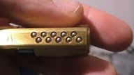 10 pinowa wkładka z suwakami otworzona bez klucza . 10 pins lock with sliders picked