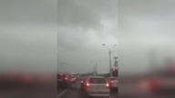 LiveLeak - Building rooftop blows into the road