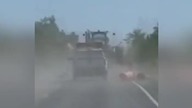 LiveLeak - Farming equipment takes out construction barriers