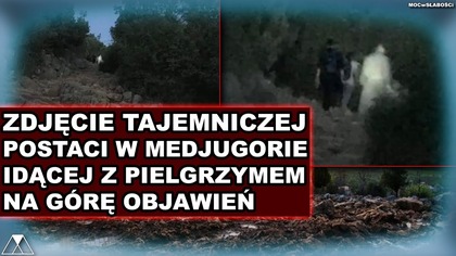 ZDJECIE TAJEMNICZEJ POSTACI W MEDJUGORIE IDACEJ Z PIELGRZYMEM NA GORE OBJAWIEN