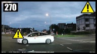 Wjezd osobówki BMW i taxi pod prąd na rondzie
