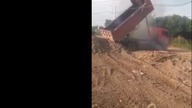 LiveLeak - Dump truck stuck on some power lines