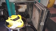 Cleaning the hearth in the eco-coal oven.  Parkside ash vacuum cleaner.