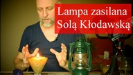 Lampa solna świecąca żywym ogniem.  Oliwa jako paliwo.