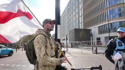 Police surround man and tell him he cant fly an England flag